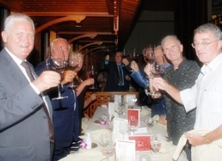 Members toast to the club’s 10th anniversary.